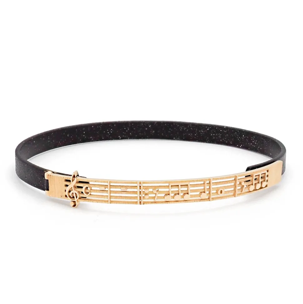 Pulsera de bronce y oro con notas musicales
