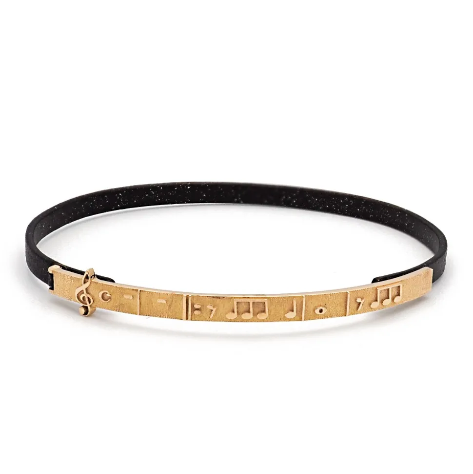 Pulsera fina de bronce y oro con notas musicales